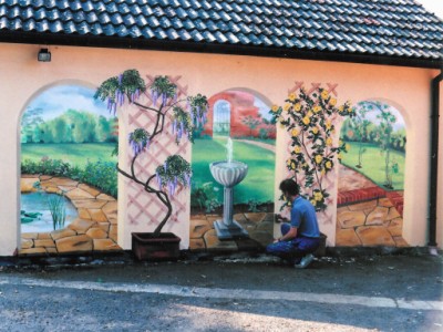 Picture of Colin painting mural