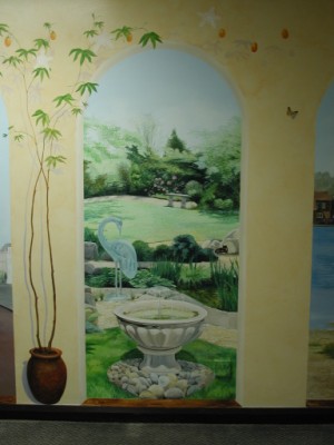 Close up of mural depiciting hospice garden scene 